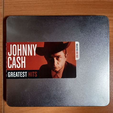 johnny_cash_ _greatest_hits_ steel_box_collection|JOHNNY CASH GREATEST HITS STEEL BOX COLLECTION.